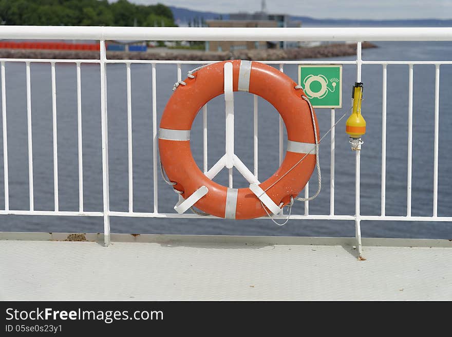 Next to lifeboats life buoys belong to the essential life saving equipment on ships like the one here on a ferry boat in Norway. Next to lifeboats life buoys belong to the essential life saving equipment on ships like the one here on a ferry boat in Norway.