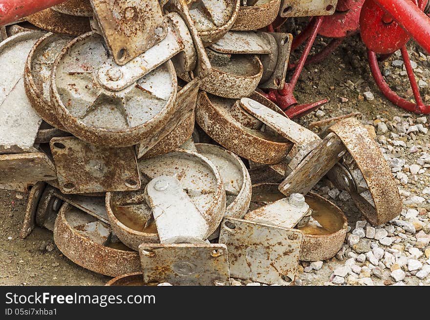 Old metal wheel of the scaffold around the construction site