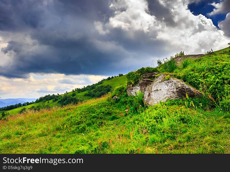 Boulders under a large cloud