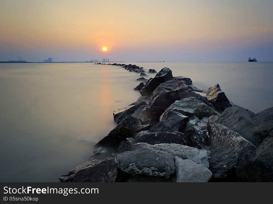 The rocks, beach and the sunset - long exposure. The rocks, beach and the sunset - long exposure