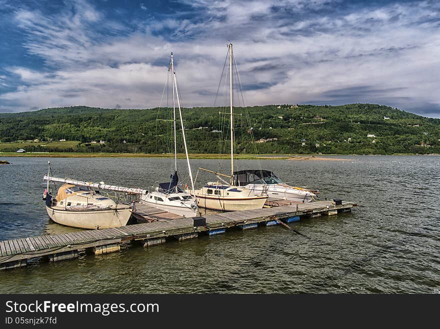 Boats in a Marina with a bright blue sky