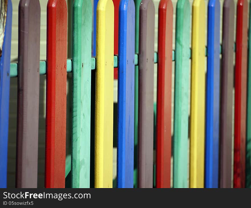 A bright multicolored wooden fence as a background