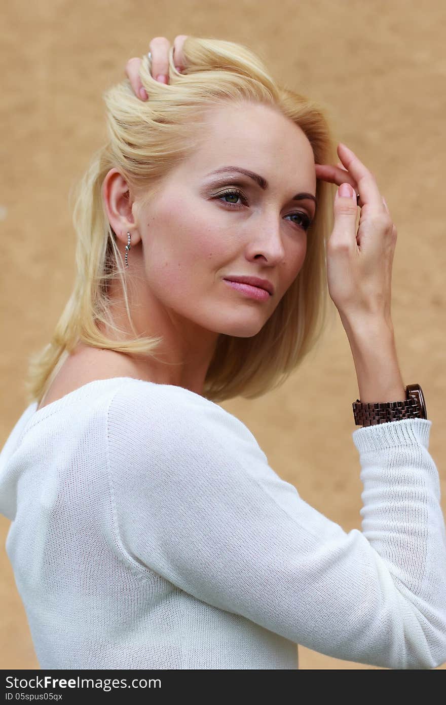 Portrait of a beautiful young glamour girl on a light background. Portrait of a beautiful young glamour girl on a light background