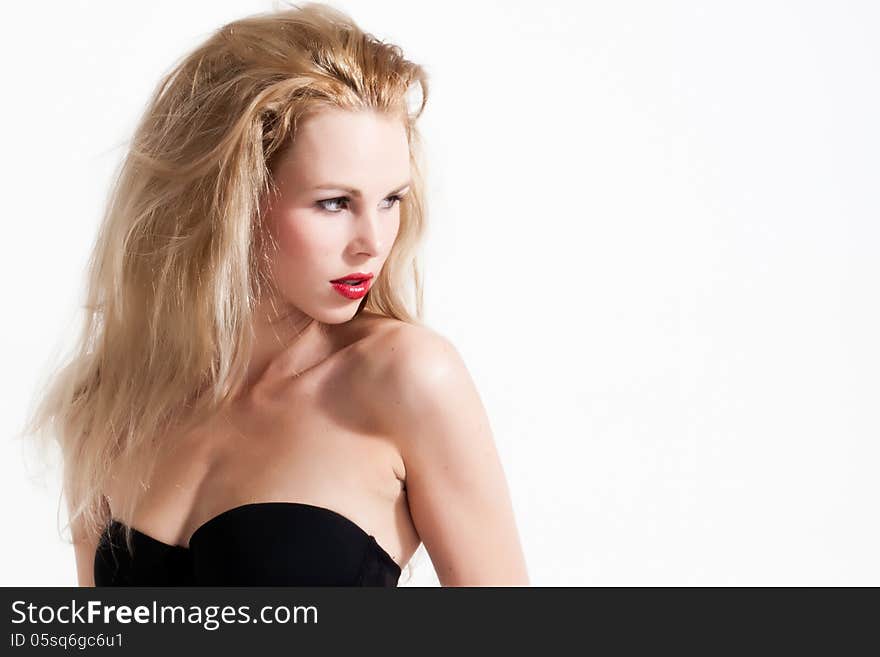 Beautifull young blond woman in the studio is being. Beautifull young blond woman in the studio is being