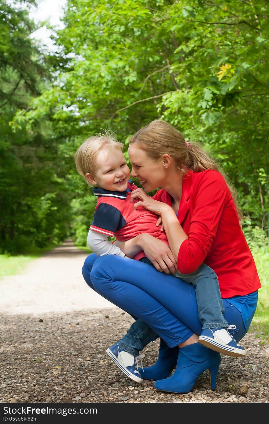 Happy mother and son having a nice day in the park. Happy mother and son having a nice day in the park