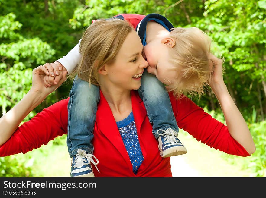 Happy mother and son having a nice day in the park. Happy mother and son having a nice day in the park