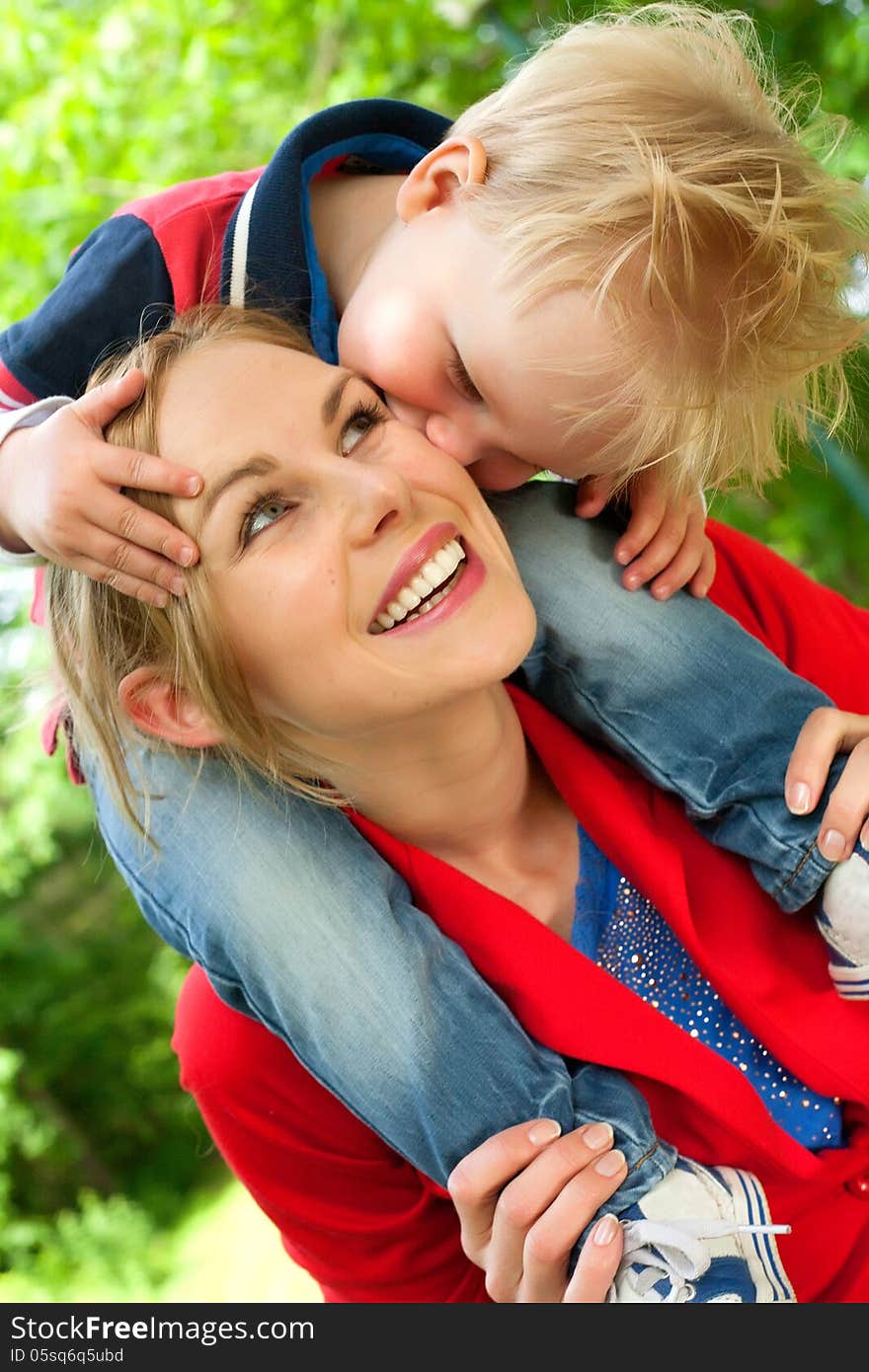 Happy mother and son having a nice day in the park. Happy mother and son having a nice day in the park