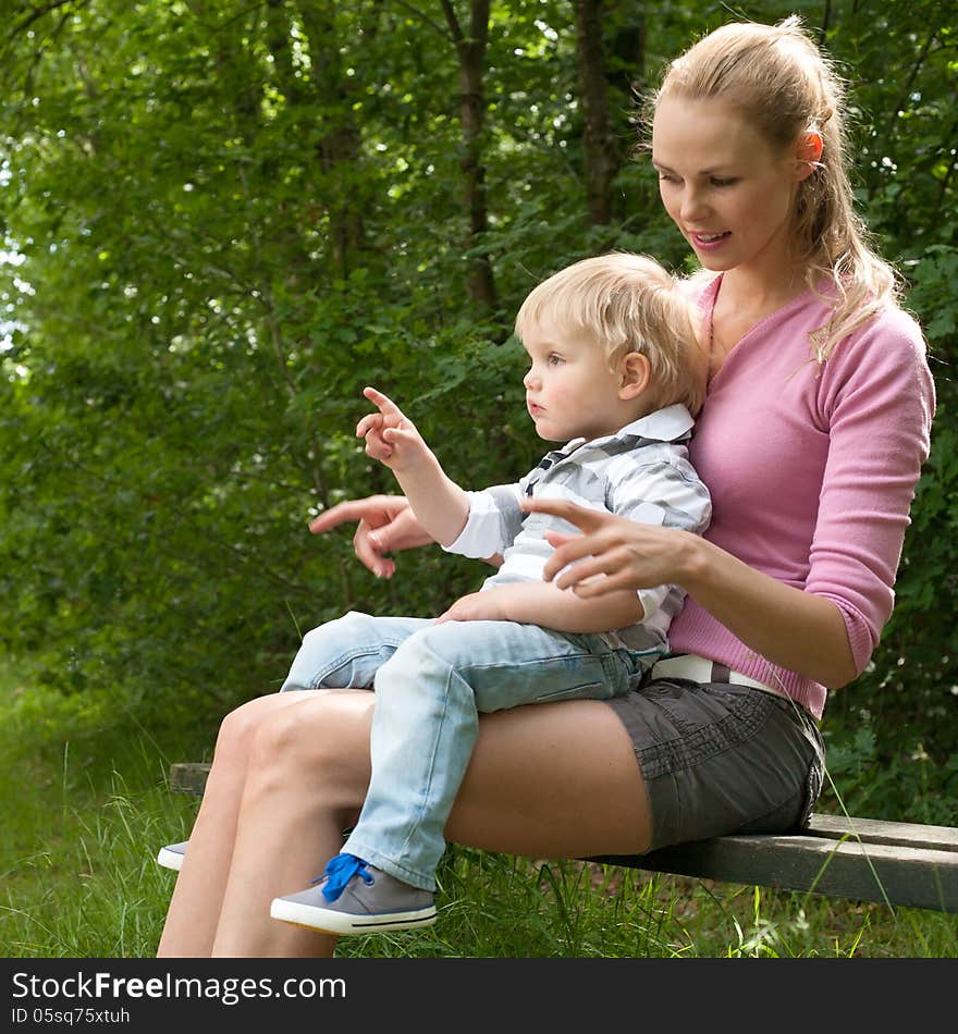 Happy mother and son having a nice day in the park. Happy mother and son having a nice day in the park