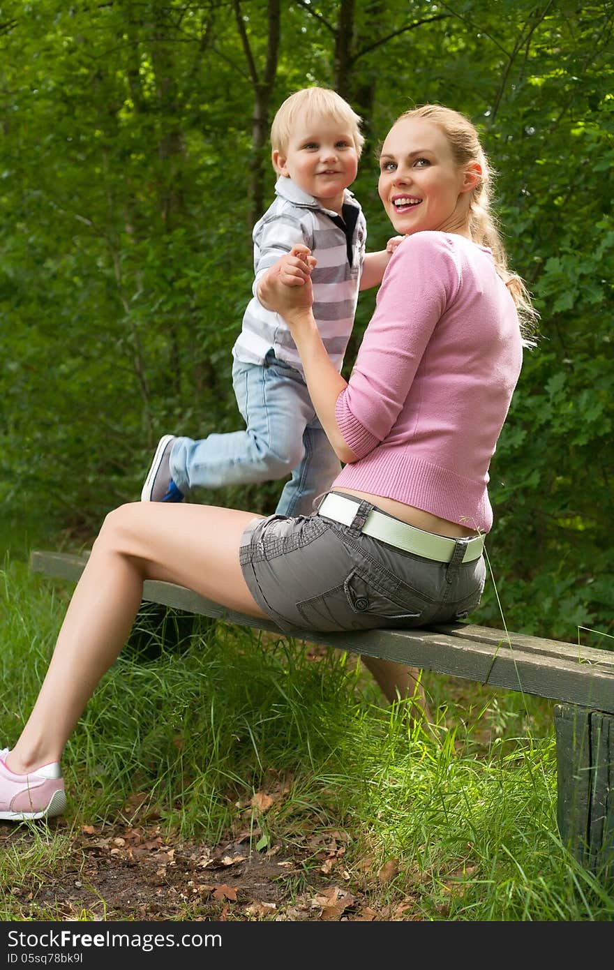 Happy mother and son having a nice day in the park