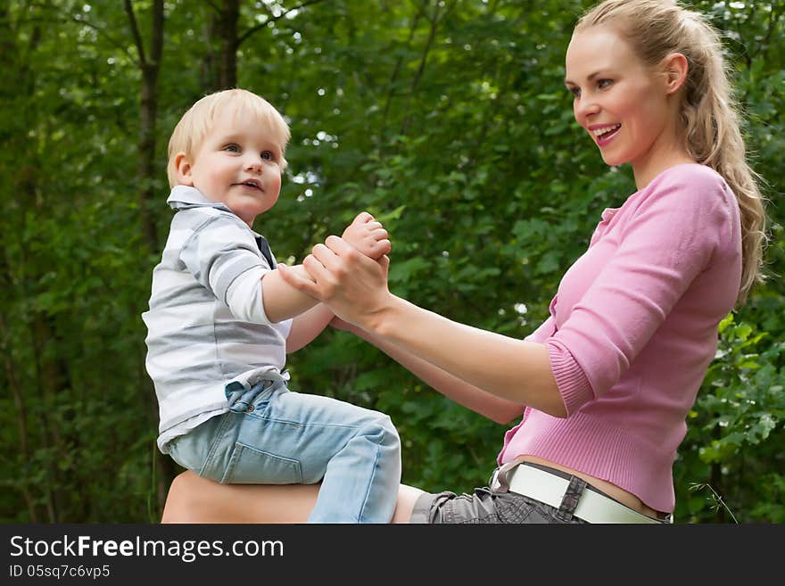 Happy mother and son having a nice day in the park. Happy mother and son having a nice day in the park