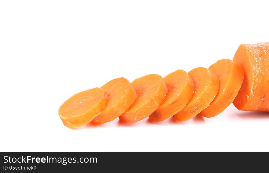 Raw carrot slices on a white background