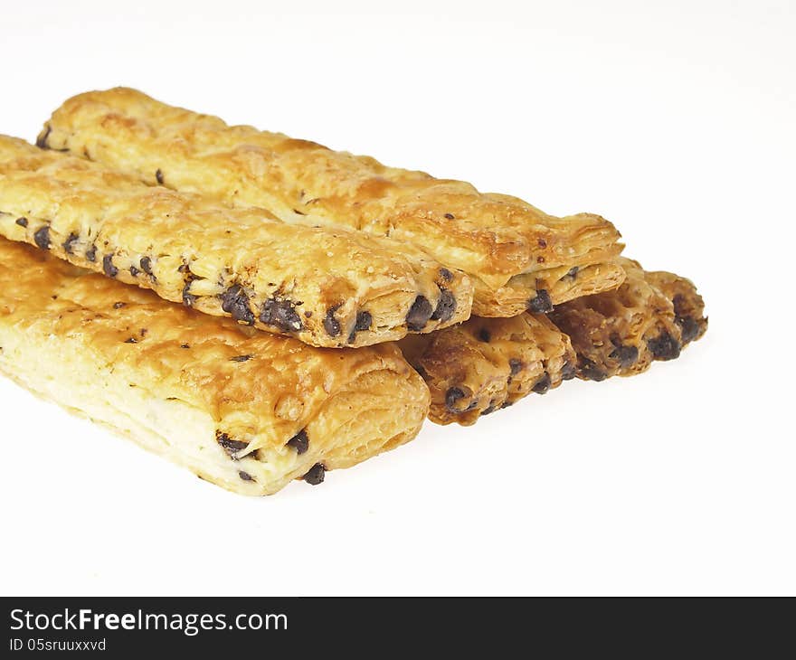 Pile of stick bread with chocolate chip inside on white background