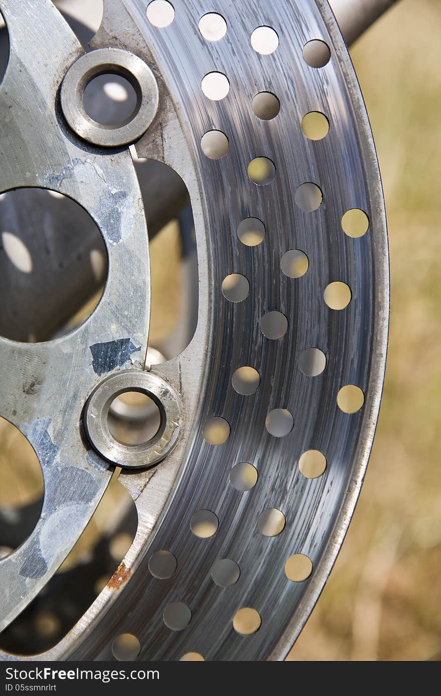 Detail motorcycle brake disc with holes for cooling