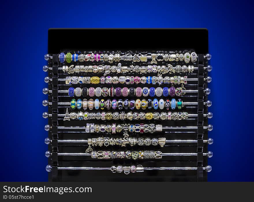 Jewellery elements on showcase with blue background