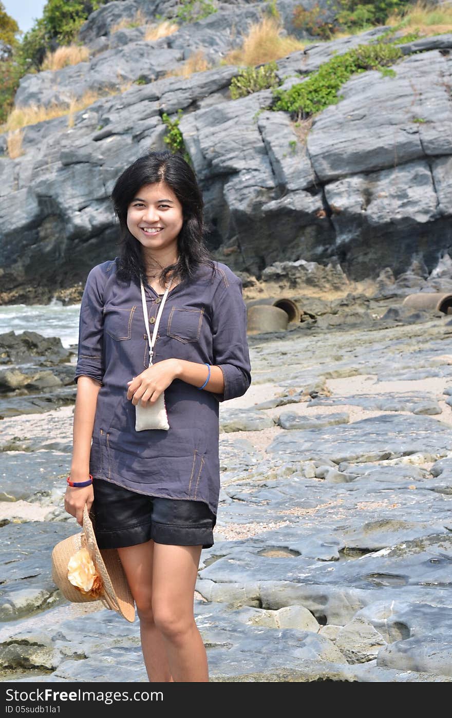 Beautiful young asian woman on beach