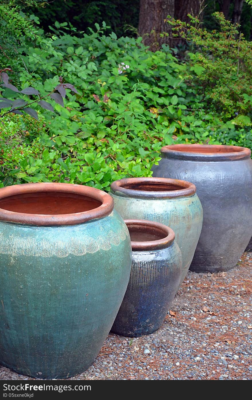 Big blue empty garden pots