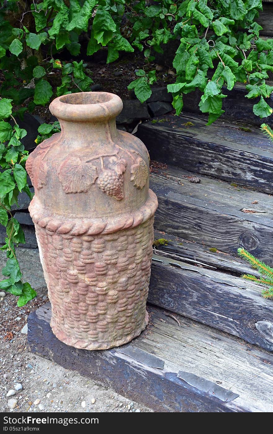 Decorative urn on wooden stairs