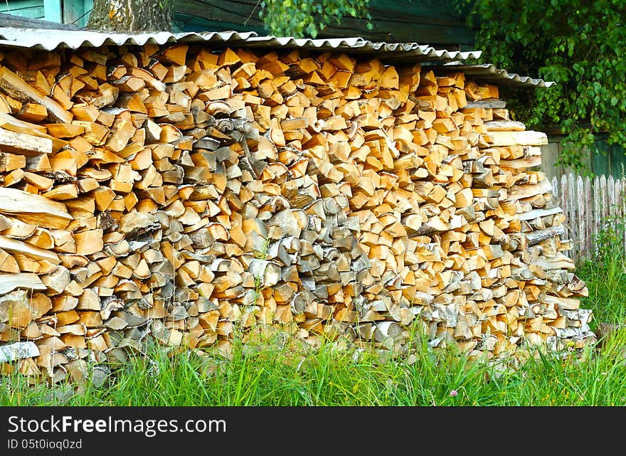 Firewood in a large number of stacked in a pile