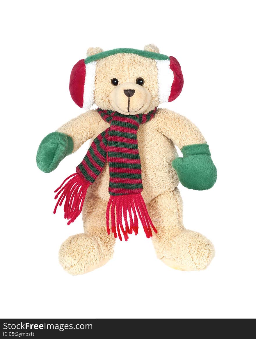 Christmas teddy bear isolated on a white background with a scarf and warm gloves.