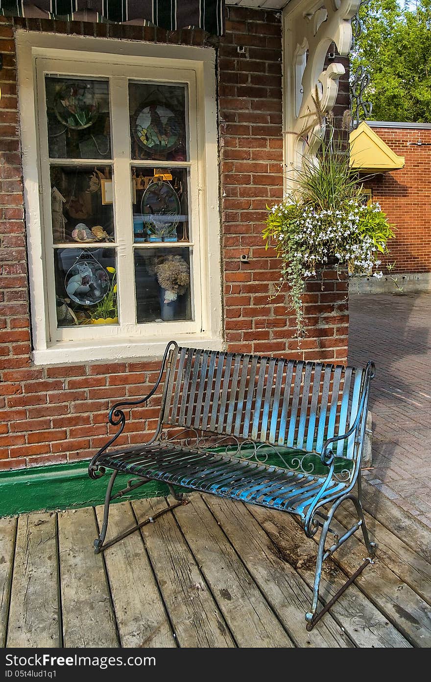 Metal bench in front of a boutique in Baie-St-Paul Quebec