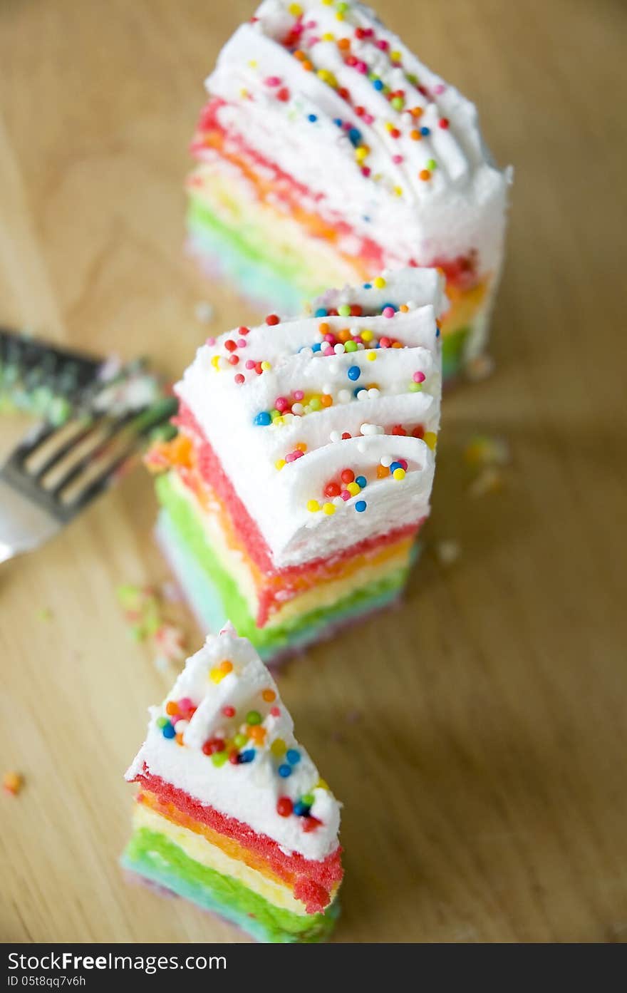 Top view of pieces rainbow cake. Top view of pieces rainbow cake