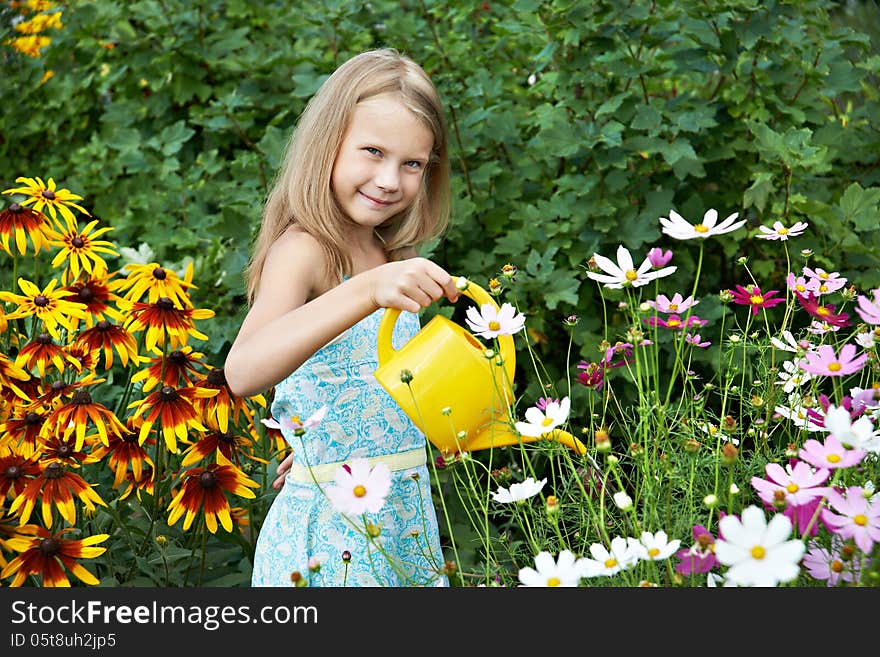 Little Girl Watering Flowers