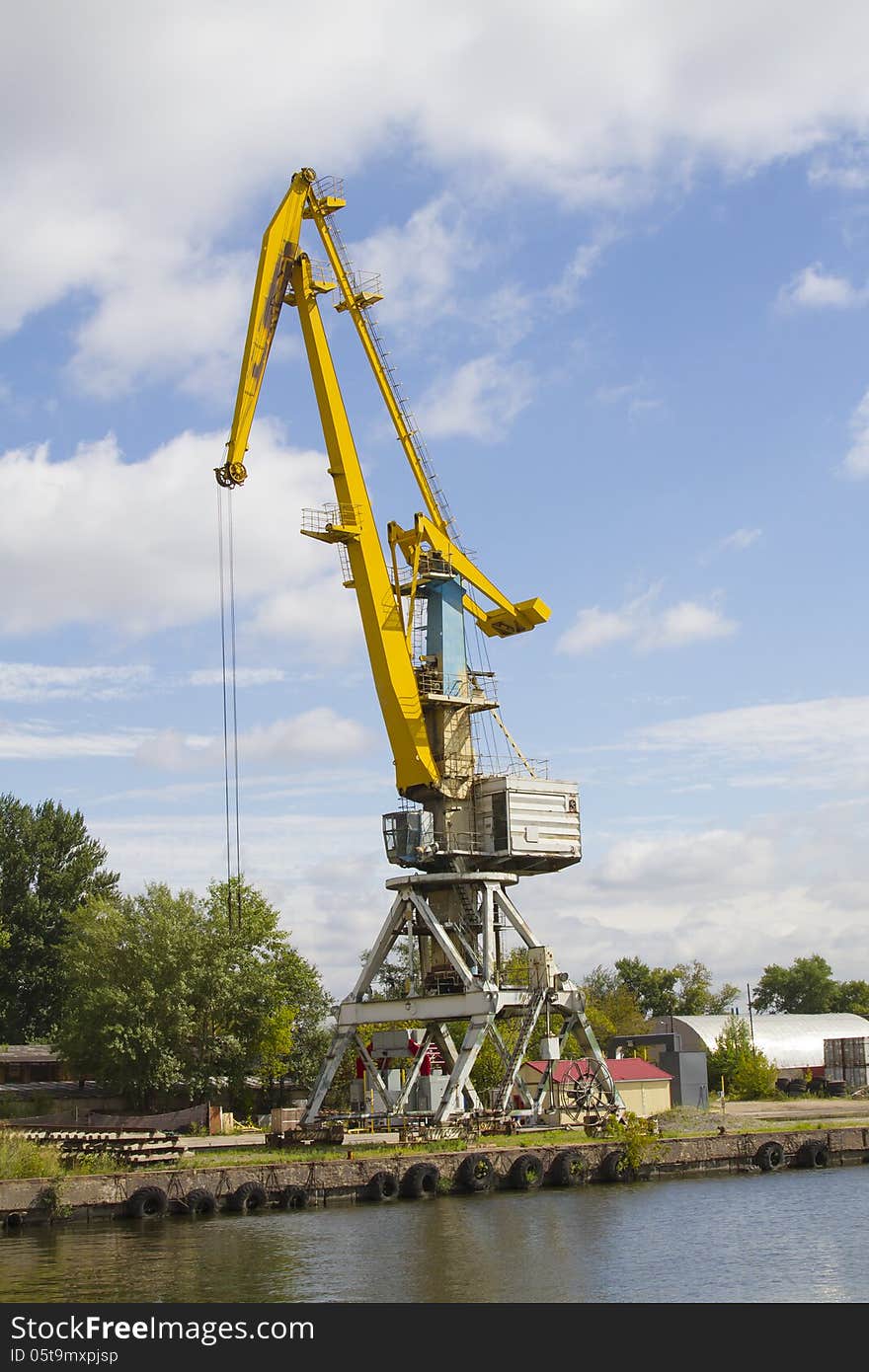 Crane Loading Cargo In The River Port