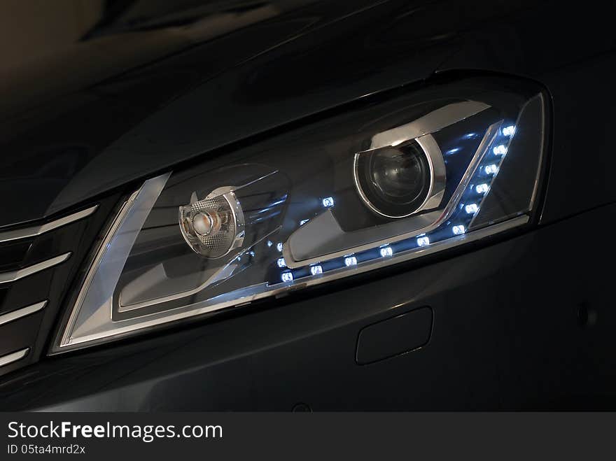 Multifunctional front headlight on a modern car. Multifunctional front headlight on a modern car