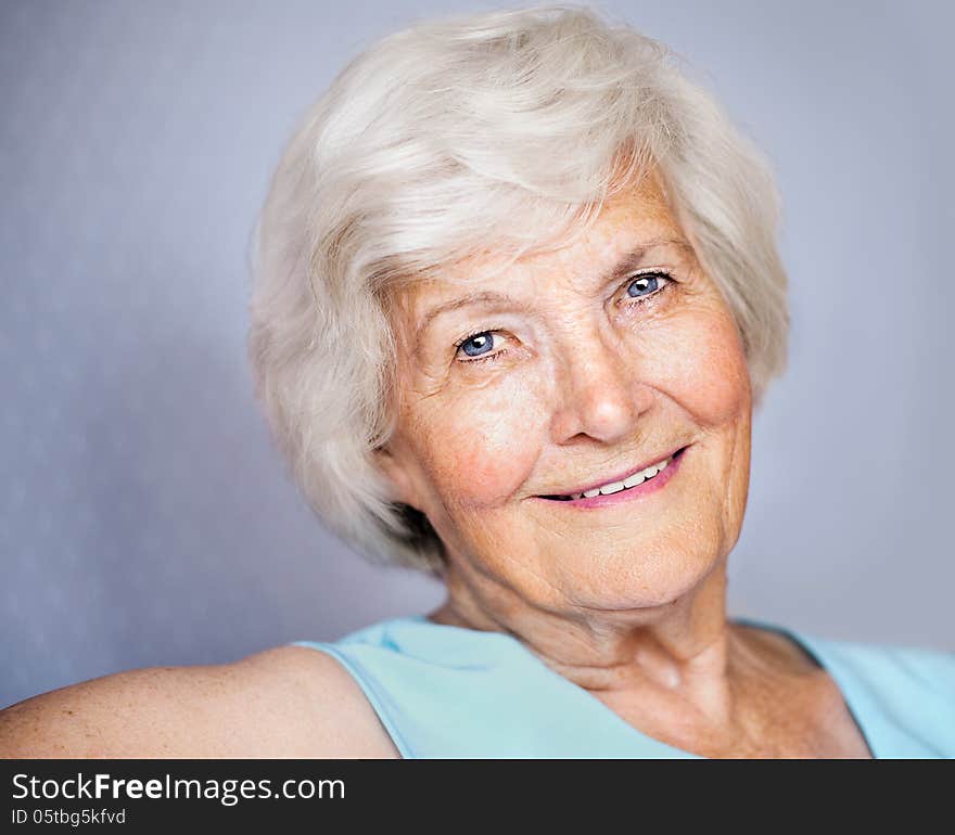 Senior lady looking relaxed at camera. Senior lady looking relaxed at camera