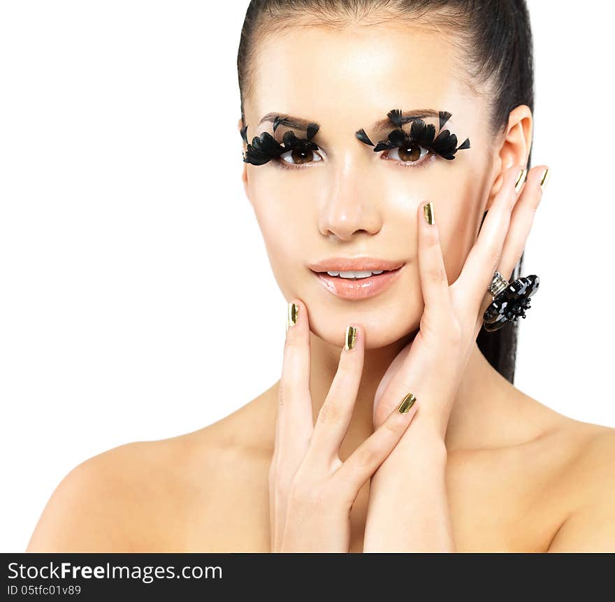 Closeup portrait of the beautiful woman with long black false eyelashes makeup and golden nails. isolated on white background. Closeup portrait of the beautiful woman with long black false eyelashes makeup and golden nails. isolated on white background
