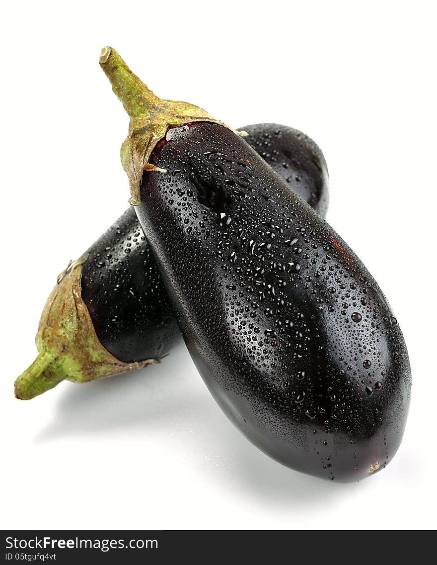 Aubergines with drops of water