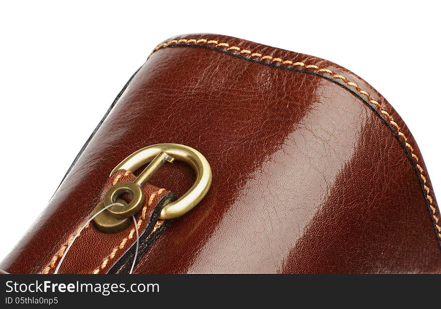 Handle of Brown Leather Briefcase closeup with Gold Details and Little Key on white background. Handle of Brown Leather Briefcase closeup with Gold Details and Little Key on white background