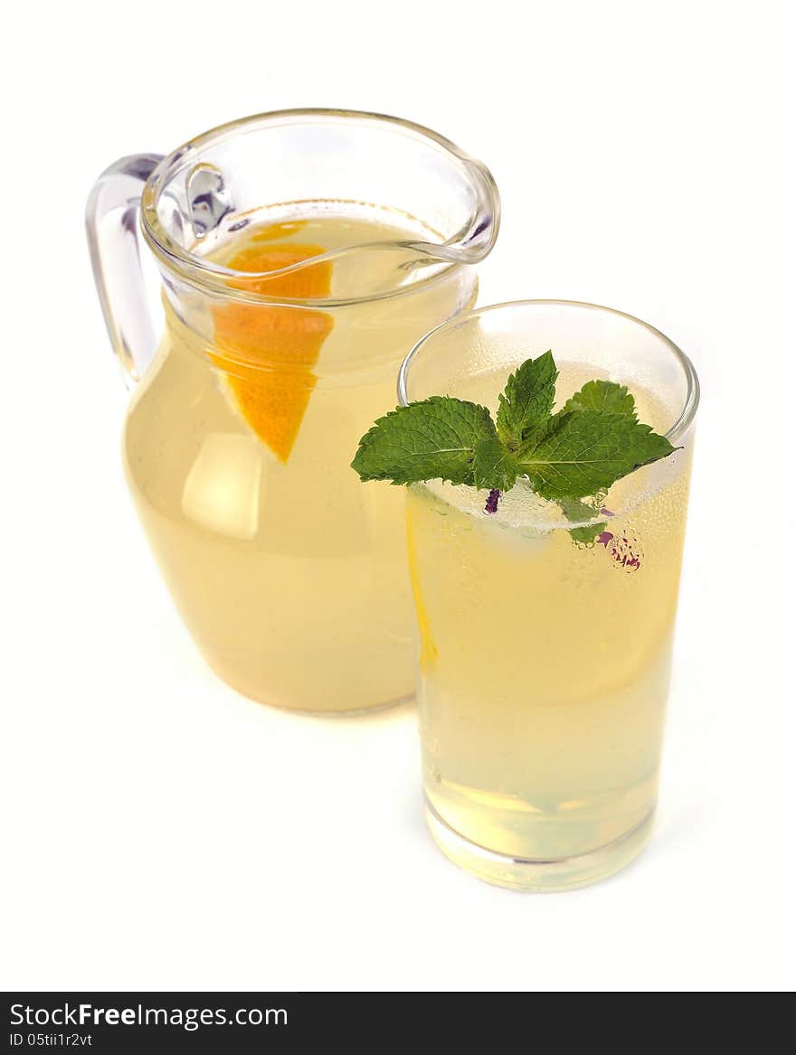 Lemon juice in a jug and a glass