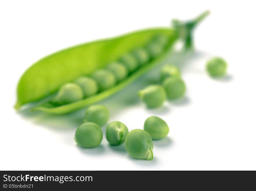 Ripe pea vegetable on white background