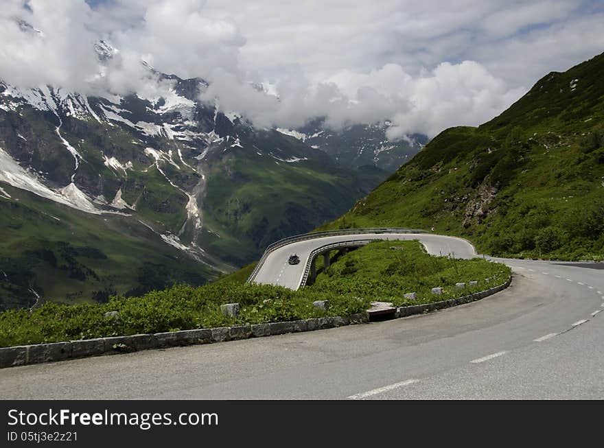 Car climb the road in alps mountain. Car climb the road in alps mountain