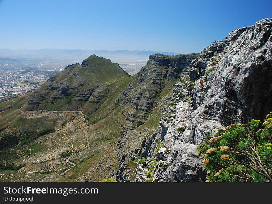 Table Mountain is a flat-topped mountain forming a prominent landmark overlooking the city of Cape Town in South Africa, and is featured in the Flag of Cape Town and other local government insignia. Table Mountain is a flat-topped mountain forming a prominent landmark overlooking the city of Cape Town in South Africa, and is featured in the Flag of Cape Town and other local government insignia