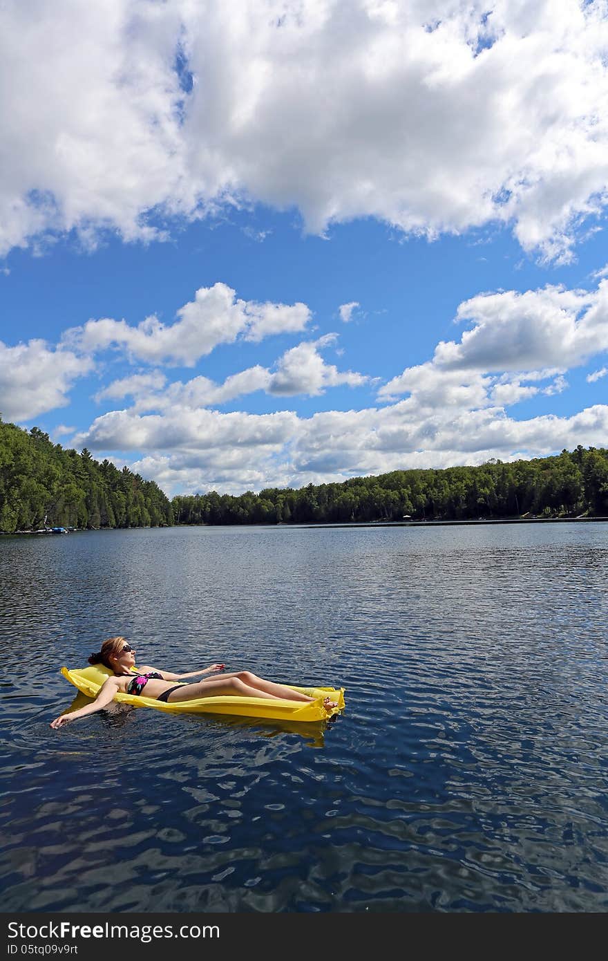 Sunbathing on the lake on a sunny day. Sunbathing on the lake on a sunny day