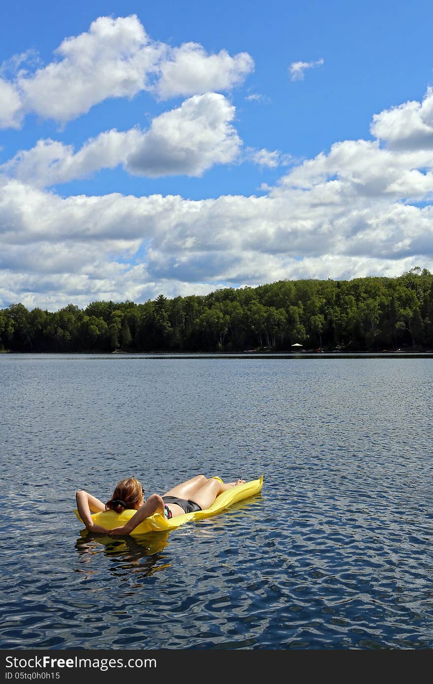 Sunbathing on the lake on a sunny day. Sunbathing on the lake on a sunny day