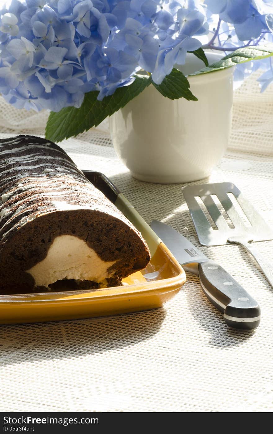 Chocolate cake with mint and blueberries on rectangular plate. From series Chocolate cake