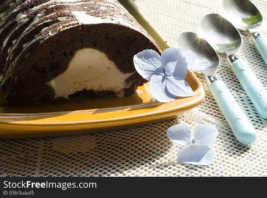 Chocolate cake with mint and blueberries on rectangular plate. From series Chocolate cake. Chocolate cake with mint and blueberries on rectangular plate. From series Chocolate cake