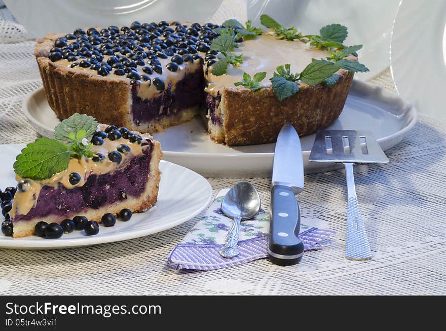 Slice Of Blueberry Pie With Mint Served With Knife And Paddle For Cake