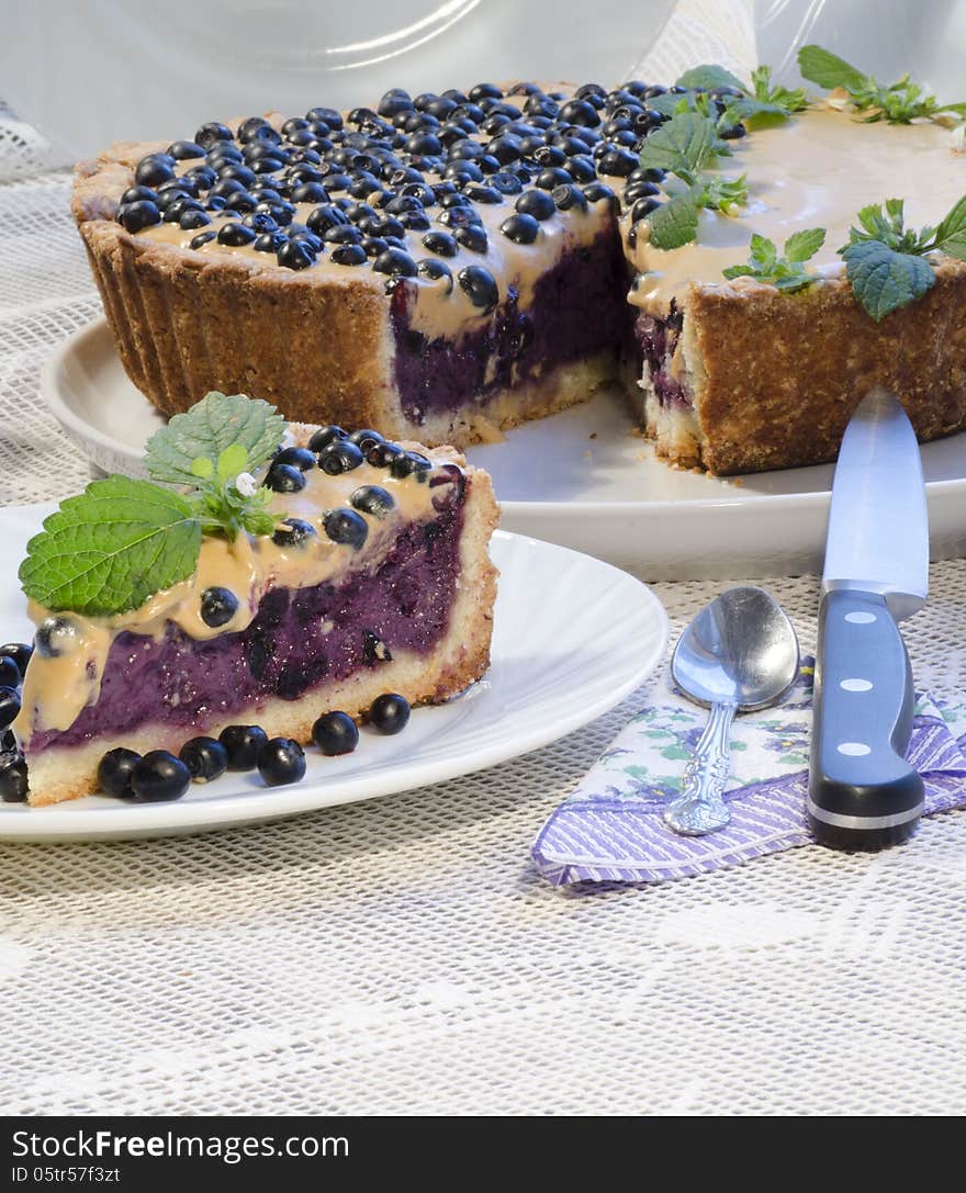 Blueberry pie with mint and sweetened condensed milk. From series Tart with blueberry and condensed milk. Blueberry pie with mint and sweetened condensed milk. From series Tart with blueberry and condensed milk