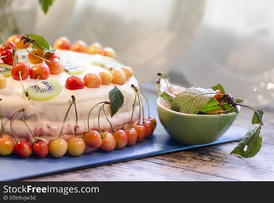 Bird-cherry flour cake with cherries, strawberries and kiwi. Homemade cake. From series bird-cherry cake