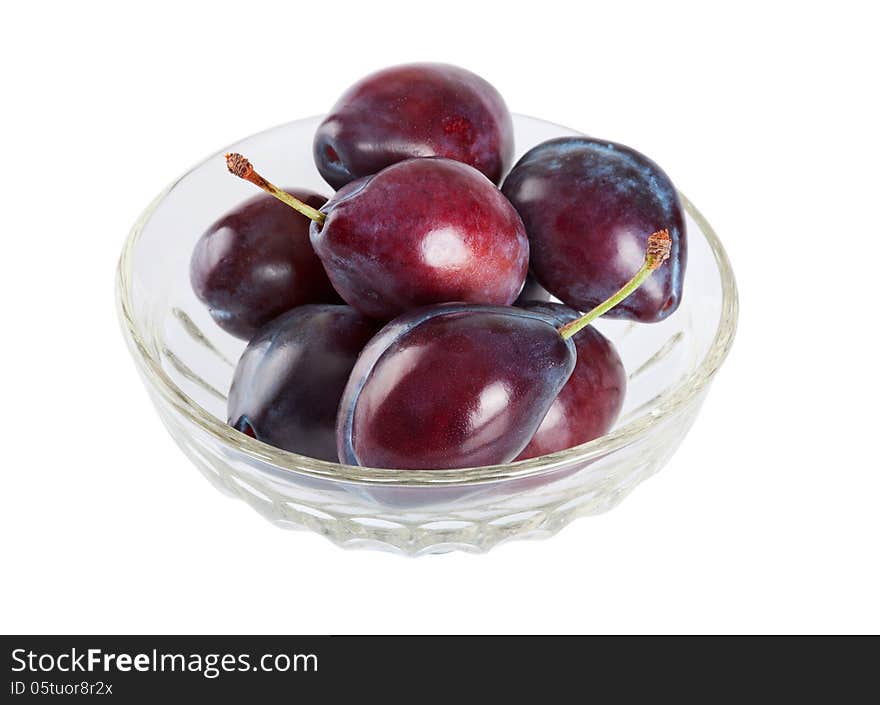 Ripe plums in a dish