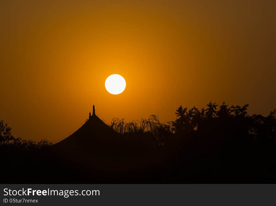 Sunset over Beihai Park, an imperial garden northwest of the Forbidden City in Beijing.