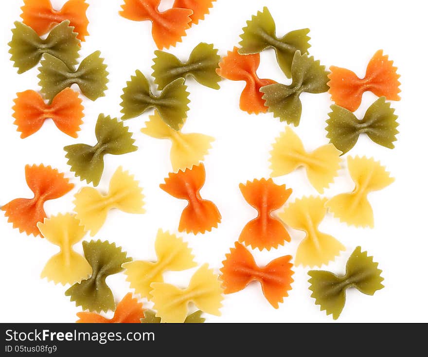 Background of the farfalle pasta three colors. Close up.