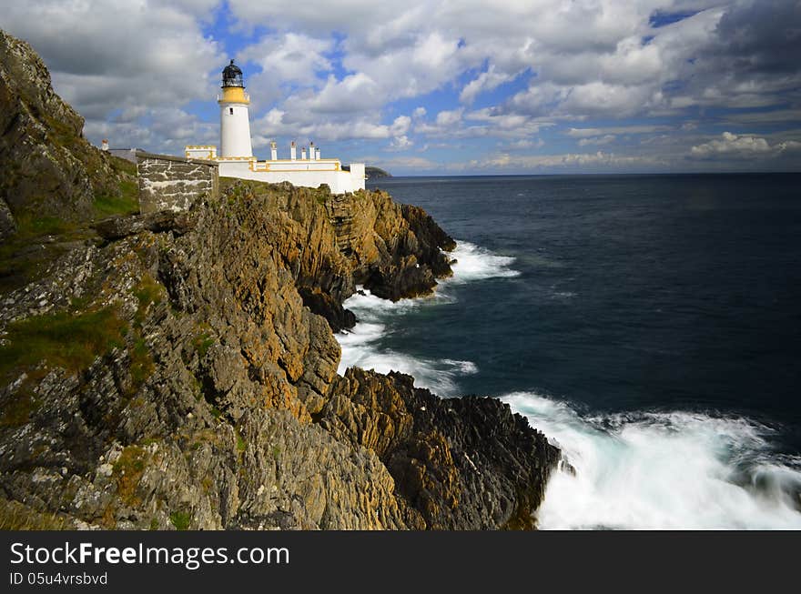 lighthouse on cliff edge normal day