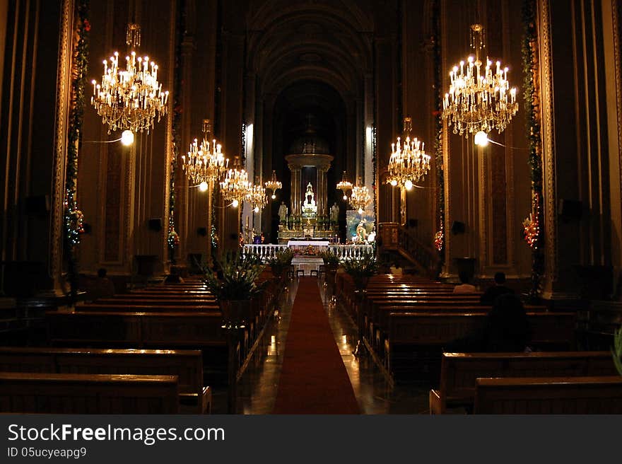 Inside view of the great Morelias Cathedral, Mexico. it's christmas eve, a lot of people is preparing the great party, but there are sacred places like this, where meditation and introspection is found. Inside view of the great Morelias Cathedral, Mexico. it's christmas eve, a lot of people is preparing the great party, but there are sacred places like this, where meditation and introspection is found.