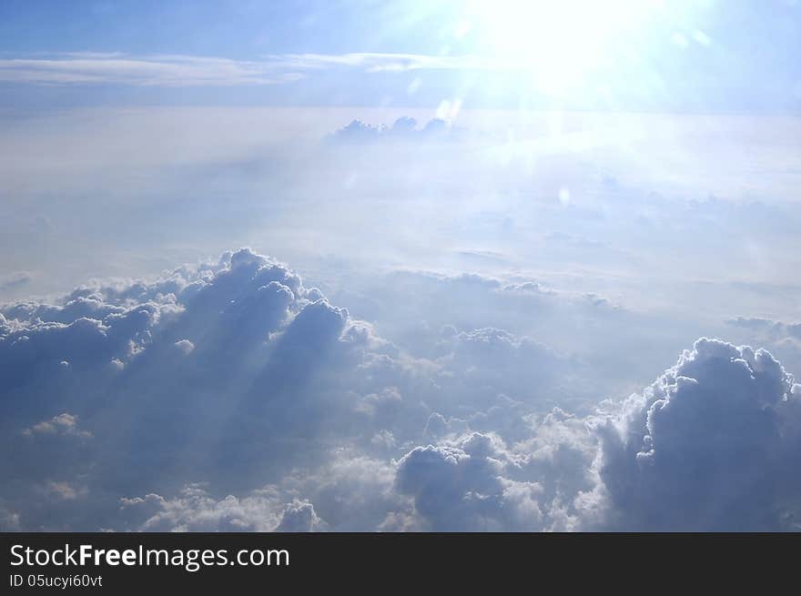 Air view near Mexico City. The magnificent clouds make some shadows mixing with the strong sunlight among the clouds. Air view near Mexico City. The magnificent clouds make some shadows mixing with the strong sunlight among the clouds.