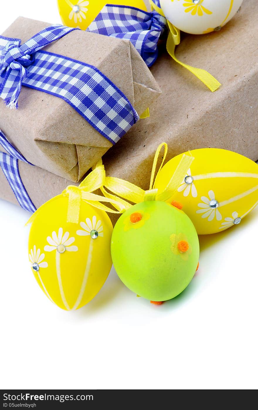 Arrangement of Gift Boxes with Ribbons and Easter Eggs on white background. Arrangement of Gift Boxes with Ribbons and Easter Eggs on white background